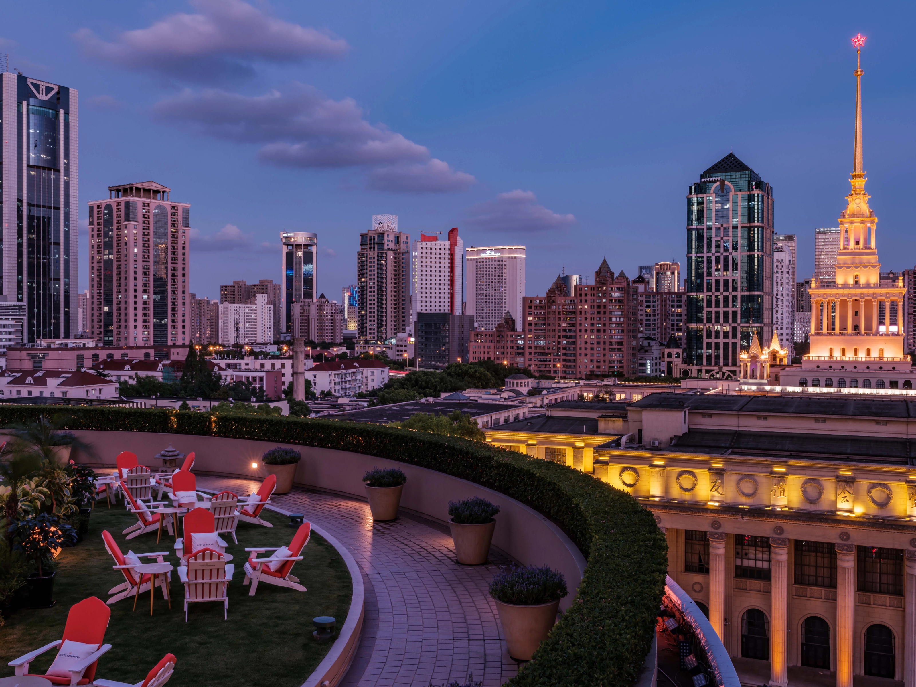 Shanghai skyline and illuminated historic buildings at dusk